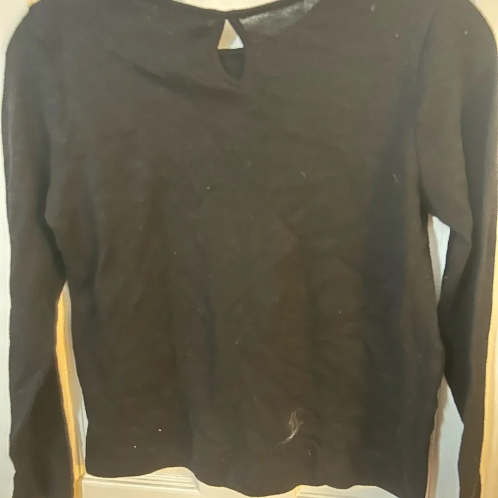 The children’s place black sweater with sequins stars.